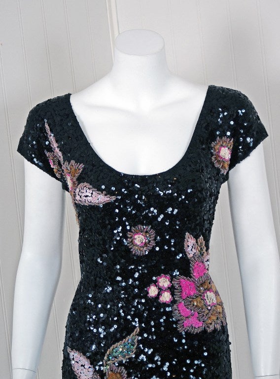 1950's Gene Shelly designer garments are in a class of their own. They are always fully-sequined by hand and fit to flatter the figure. This treasure has a fantastic abstract-garden design worked in, featuring iridescent-beadwork around