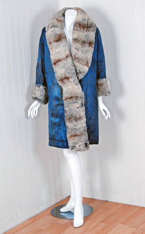 This breathtaking and unbelievable late 1920's metallic print blue-lame brocaded satin & genuine chinchilla-fur coat will make any woman shine during cold snowy months. The care to piece the chinchilla together after carefully selecting matching