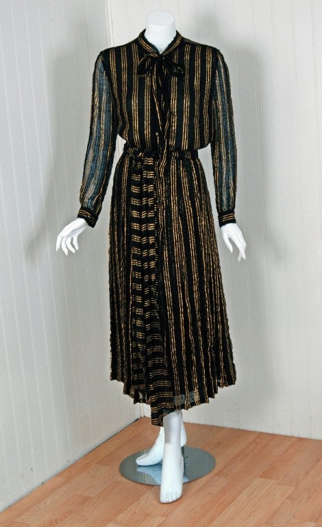 Chanel is known to be one of the most luxurious and decadent fashion houses in the world. This stunning 1970's metallic-gold & black semi-sheer striped 
