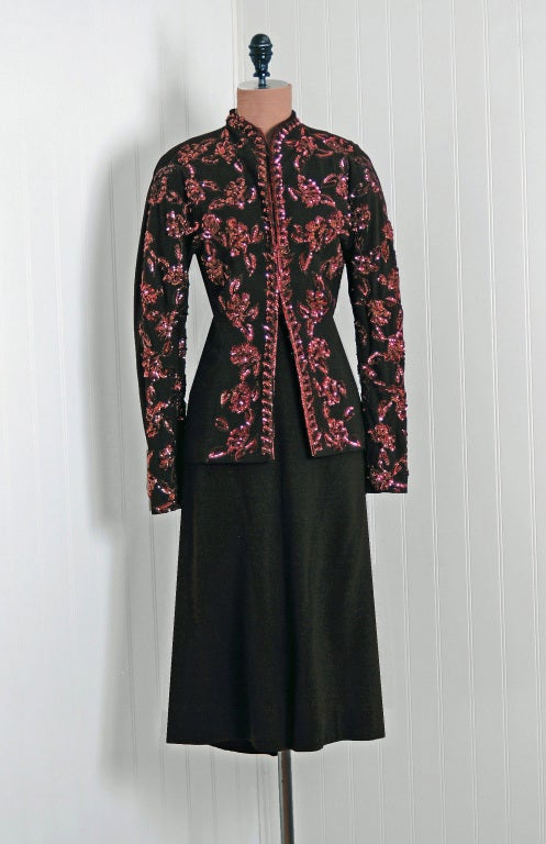 Nettie Rosenstein garments are very hard to come by and this stunning early 1940's light-weight chocolate brown wool-crepe dress suit is a perfect example of her genius. I love the embroidered metallic-threading and sparkling copper sequins. The
