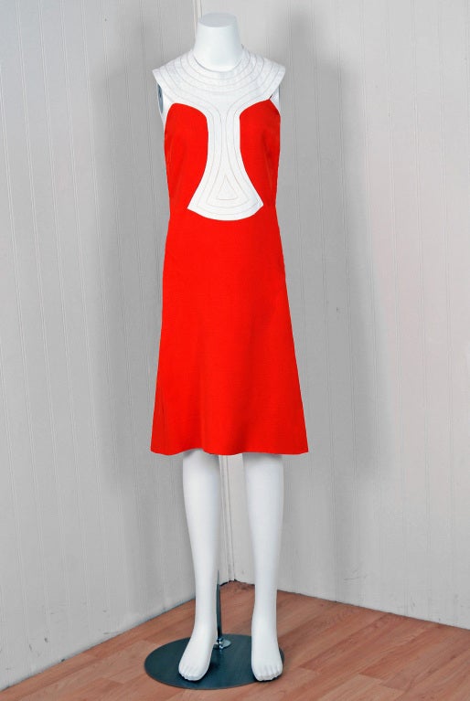 Spectacular mid 1960's Pierre Cardin designer dress in vibrant orange & crisp-white lined cotton-linen. In 1951 Cardin opened his own couture house and by 1957, he started a ready-to-wear line; a bold move for a French couturier at the time. The