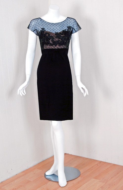 An amazing and highly stylized 1950's cocktail dress by Peggy Hunt. The silhouette is classic pin-up 