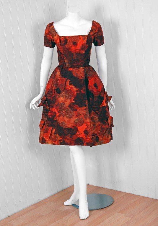 Early Michael Novarese garments are incredible rare and hardly go up for sale. In this gorgeous 1960's orange-roses print jacquard-silk party dress,the detailed construction and meticulous attention to detail are comparable to what you will find in
