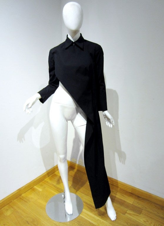 Yohji Yamamoto first showing in Paris during the early 1980's created much press and established his name, although his designs were often not well understood. Yamamoto?s designs are unstructured and non-traditional. This amazing asymmetric jacket