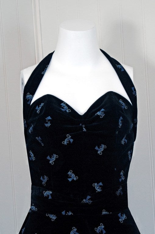 This is perhaps the most darling and flattering 1950's dress set I have ever seen. Fashioned from rich jet-black velvet, this 