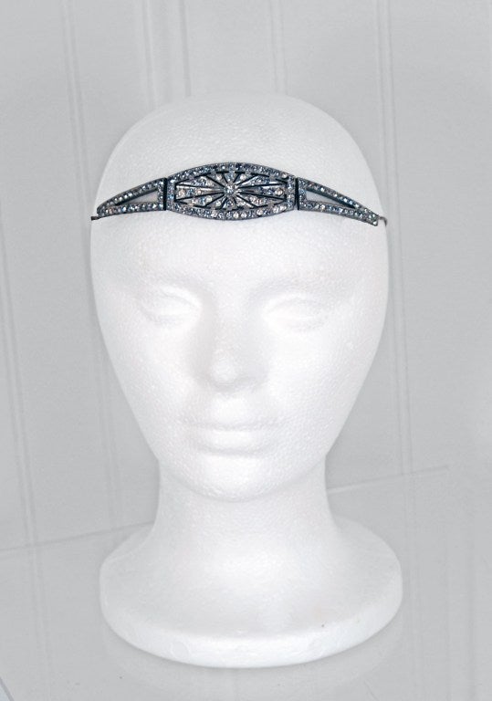 This is, without a doubt, one of the most breathtaking 1920's antique headpieces I have ever laid eyes on. Made from silver, the bandeau is finished with sparkling rhinestones and marcasites. Headpieces were very popular in the Art-Deco era and were