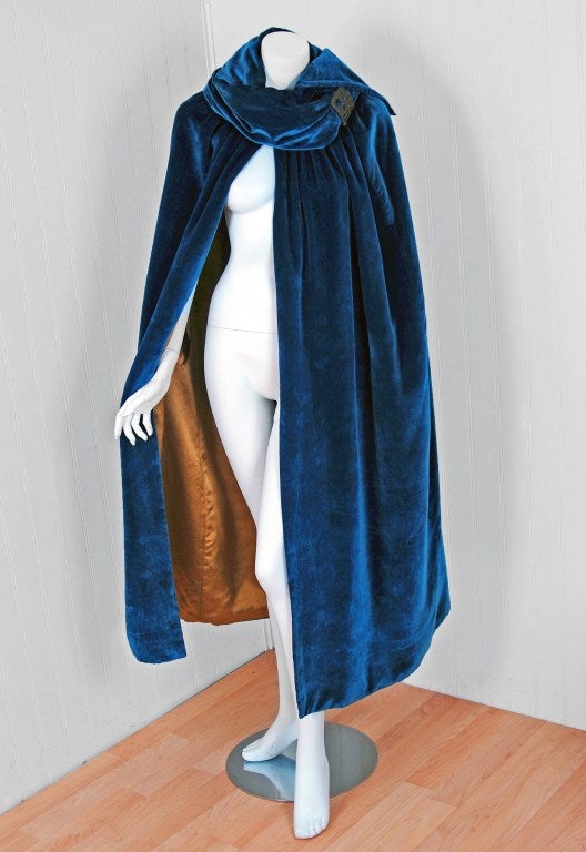 Breathtaking 1920's French metallic-gold threaded sapphire-blue velvet evening cape-coat. Evening capes from the art-deco era remain a perennial favorite, perhaps because no other period combined such opulence with youthful sass. The casual,