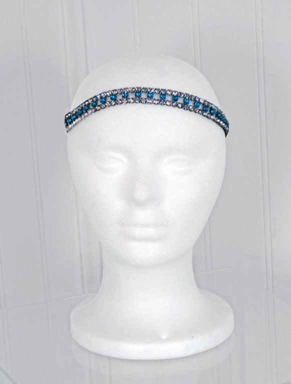 Regal rhinestone and brass-colored metal headpiece from the mid 1920's. Prong-studded with tons of sparkling rhinestones in the most amazing teal-blue & clear color combination. These pieces were very popular in their time and were the crowning