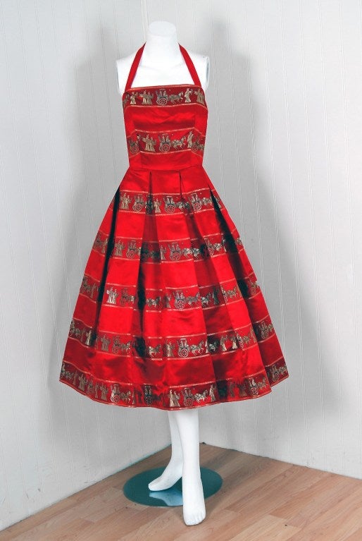 With its vivid ruby-red satin print and flawless silhouette, this party dress has the casual elegance the 1950's were known for. The Roman-Empire pattern is woven into the fabric and is one of the best designs I have seen from this time period. The