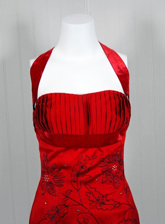 An amazing and highly stylized 1950's cocktail dress by Ce-Bon. The silhouette is classic pin-up 