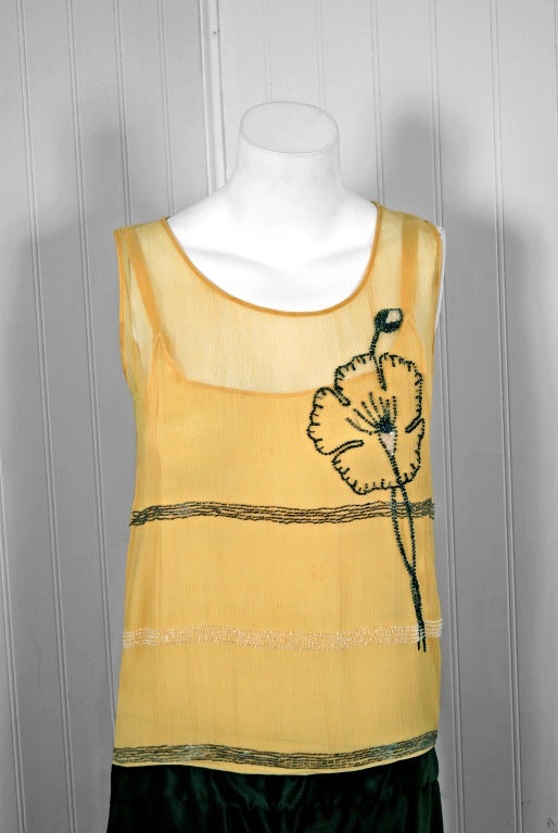 There are lots of lovely 1920's garments still around, but every once in a while I come across one that sets my heart a flutter! This is an extraordinarily beautiful and exceptional 1920's two-tone sleeveless flapper dance dress. The yellow