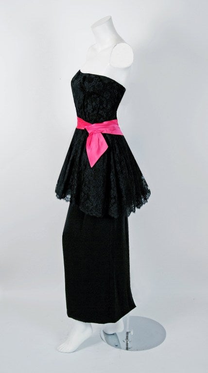 This is such a seductive and dramatic 1950's evening gown from the iconic Ceil Chapman designer label. Perfect for any upcoming event; you can't help but feel feminine in this beauty! The garment is fashioned from stunning black French