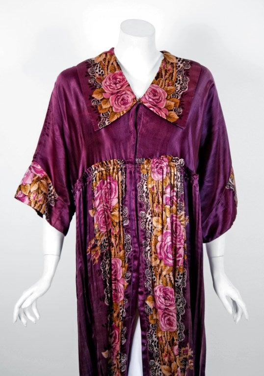 Heaven on earth! With its wide cropped-sleeves and breathtaking silhouette, this rare garment makes a memorable impression. The art-nouveau purple roses floral print is unbelievable; the brilliant colors cannot be matched today. It has the most