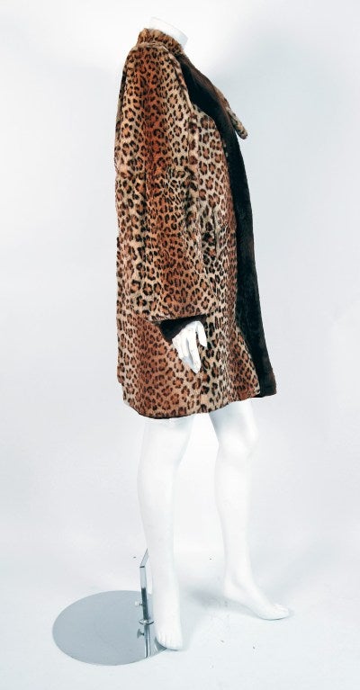 This exquisite late 1930's leopard-print mouton genuine fur coat will make any woman shine during cold winter months. The soft fur has been dyed to resemble a perfect leopard pattern and the effect is really breathtaking. The care to piece this