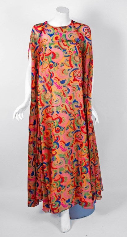 Breathtaking psychedelic paisley-print chiffon gown created by American designer Oscar de la Renta when he was head designer for Elizabeth Arden in the 1960's. Trained by Cristóbal Balenciaga and Antonio Castillo, he became internationally known in