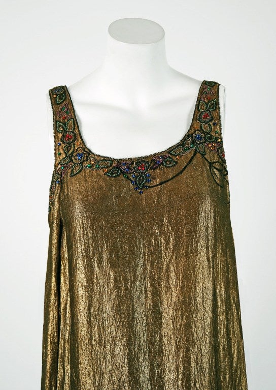 Breathtaking 1920's museum-quality beaded & rhinestone metallic gold-lame evening dance dress. The ethereal color palette touches a deep chord in our collective aesthetic consciousness. As fashion lovers, we never tire from antique metallics; they