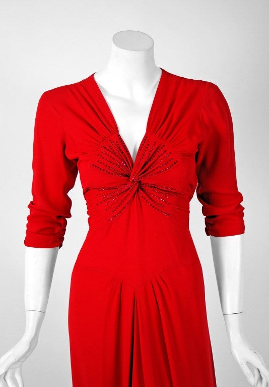 A stunning cherry-red deco gown from the 