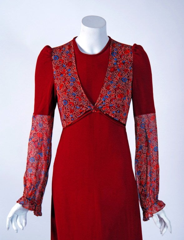 A charming burgundy-red crepe Radley dress that is both timeless and chic. Radley was a British clothing manufacturing company of the 1960's through the early 1980's. The main designer for the company, Raymond “Ossie” Clark, was a leading light in