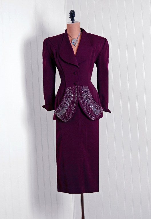 Lilli Ann was started in San Francisco in 1933 by Adolph Schuman, naming his company for his wife, Lillian. The company became known for their beautiful, elaborately designed suits and coats.This stunning ensemble is fashioned in a rich fully-lined