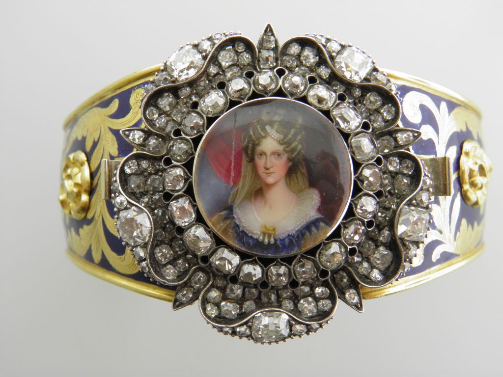 BOXED BANGLE WITH DETACHABLE IVORY FRAMED MINIATURE  OF QUEEN ADELAIDE--[WIFE OF WILLIAM IV]-------PRESENTATION PIECE---PROBABLY 1830'S---BRACELET PART OF GOLD AND ENAMEL WITH RAISED THISTLES,ROSES AND CLOVERS--REPRESENTING THE UNION OF THE UNITED
