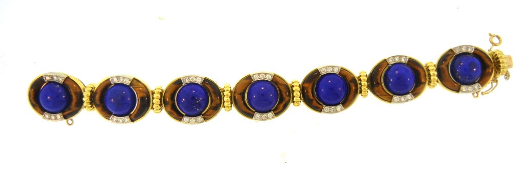 Wonderful Bracelet by Triomphe featuring Diamonds, Lapis Lazuli & Tiger's Eye mounted in 18K Gold. The Contrast between the Stones Makes it a Most Unusual & Fabulous Style.