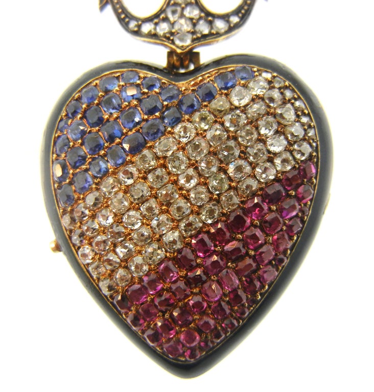 French Heart & Anchor Shaped Locket Featuring Rubies, Diamonds & Sapphires. Reverse Features Black Enamel Monogram and Dated January 1, 1872. Original Hancocks & Co. London Box.