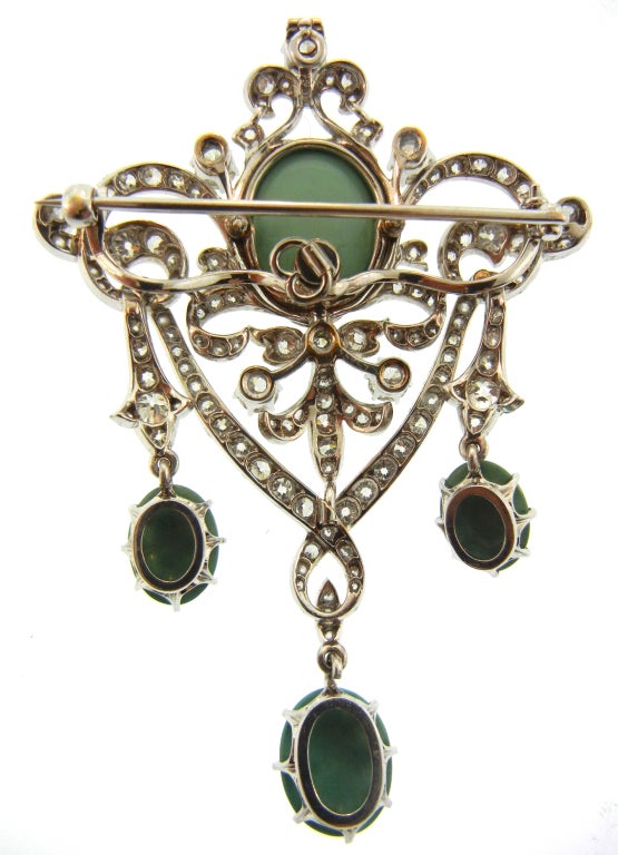 A Black, Starr and Frost lacework pendent/brooch with platinum, white gold, diamond, and Persian turquoise.