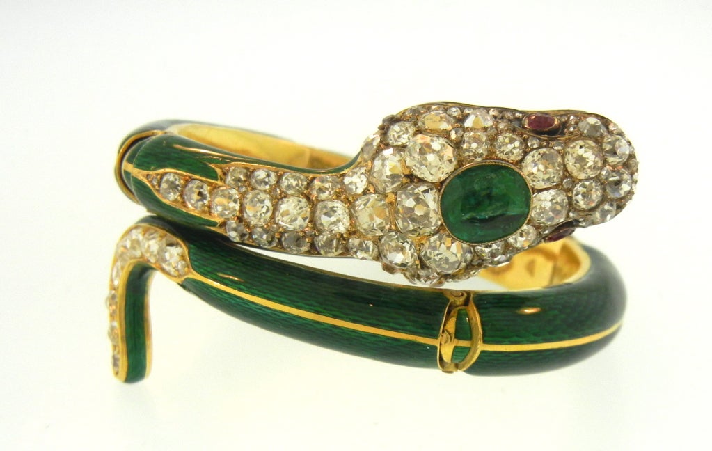 Beautiful Victorian Snake bracelet. Enamel on gold with diamonds, emeralds, and with ruby eyes. Meticulous condition, high karat, with beautiful old mine cut stones