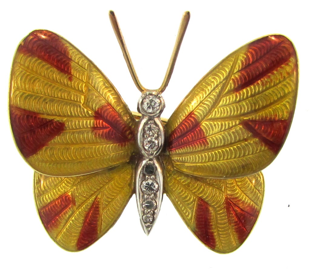 A pair of delightful Boucheron Paris enamel and diamond butterfly brooches. They are made of 18k and platinum, and are in perfect condition.