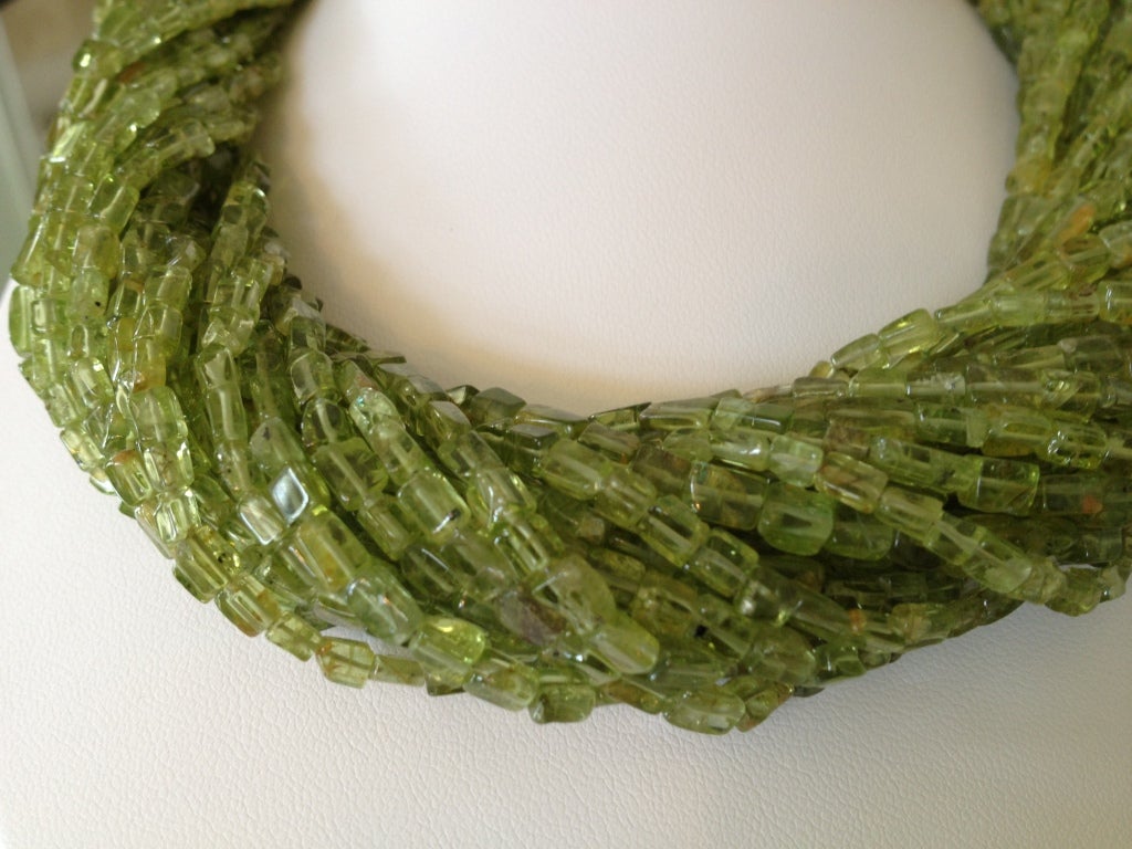 One of a kind, breathtakingly beautiful 28-Strand Peridot necklace. Necklace has large 14k gold clasp.