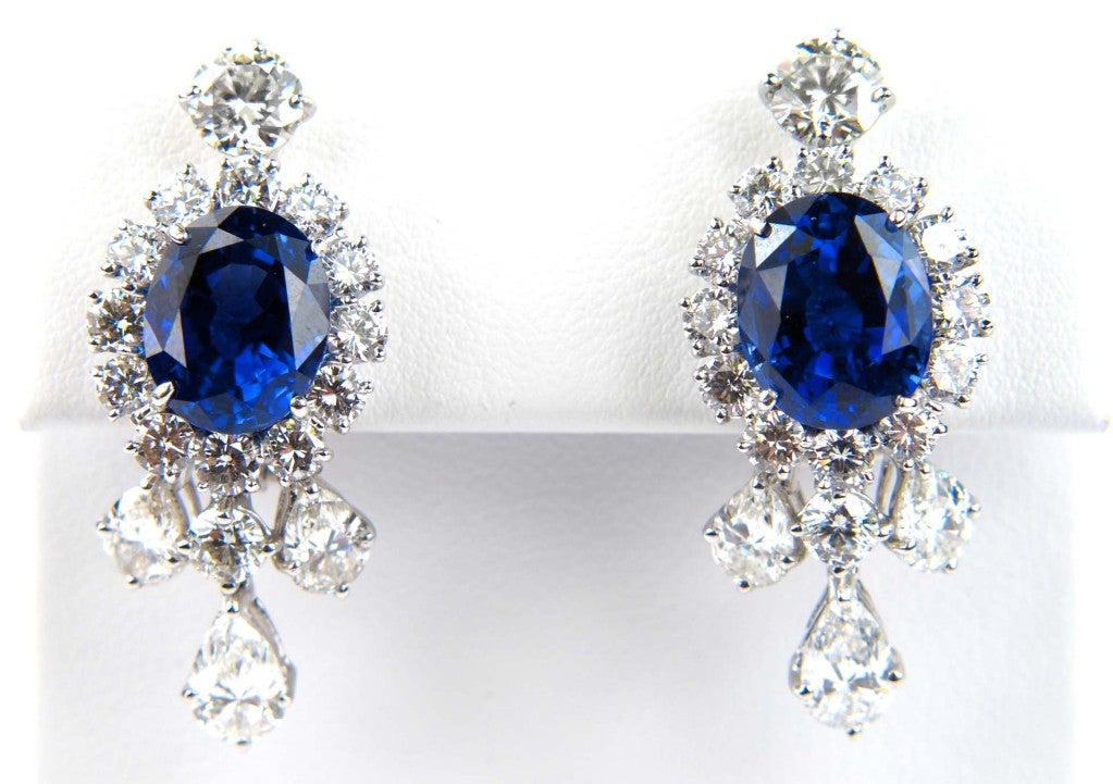 The total weight of the Earrings is 19.4 grams. One of the two oval shape Sapphire is 7.31 carats Burma (NO HEAT) and the other one is 7.42 carats Ceylon (NO HEAT). Total weight of the diamond is 5 carats, H color VS clarity. The measurement of the