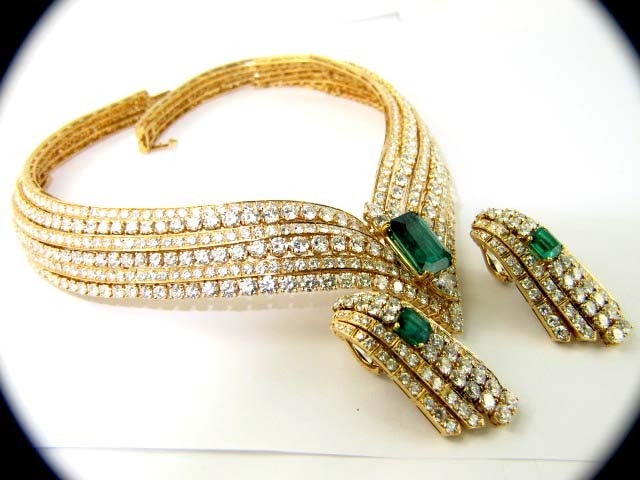 Cartier Yellow Gold Diamond and Colombian Emerald Necklace and Earring Set. The total weight of the diamond is 135ct F-color, VVS-clarity. The total weight of the Emerald is 21ct, Colombian Emerald.