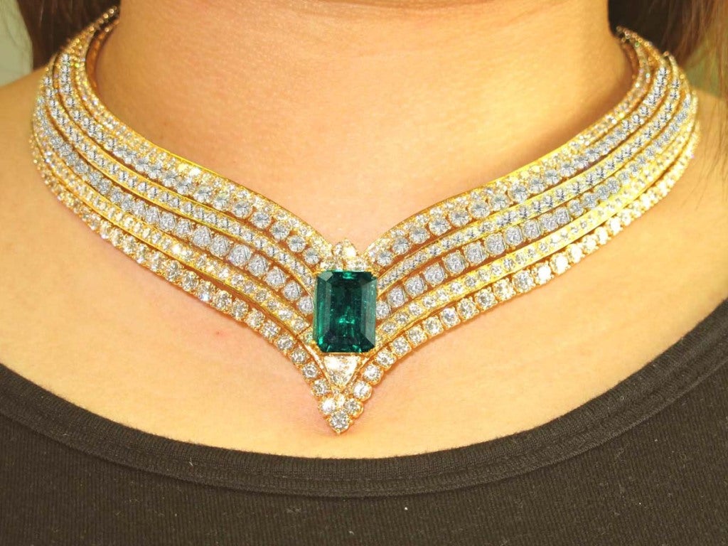 Cartier 18K Yellow Gold Diamond Emerald Necklace and Earring Set.The total weight of the diamond is 135ct Color F Clarity VVS The total weight of the Emerald is 21ct.