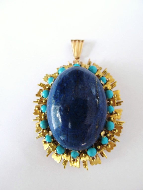 Over the top very large Lapis Cabochon & 18k sunburst with turquoise detail pendent / brooch. 
Fabulous form and quality lapis with extremely deep vibrant blue with gold detail in cabochon. 
Wonderful work on a long sautoire or chain link necklace