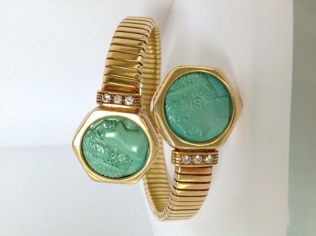 Classical chic, 18k yellow gold and richly carved turquoise signet inspired wrap bracelet with diamond details on each side. 
Simply elegant, for every day use. Great worn combined with other bangles, cuffs or a watch.

Dia of medallions: 0.8