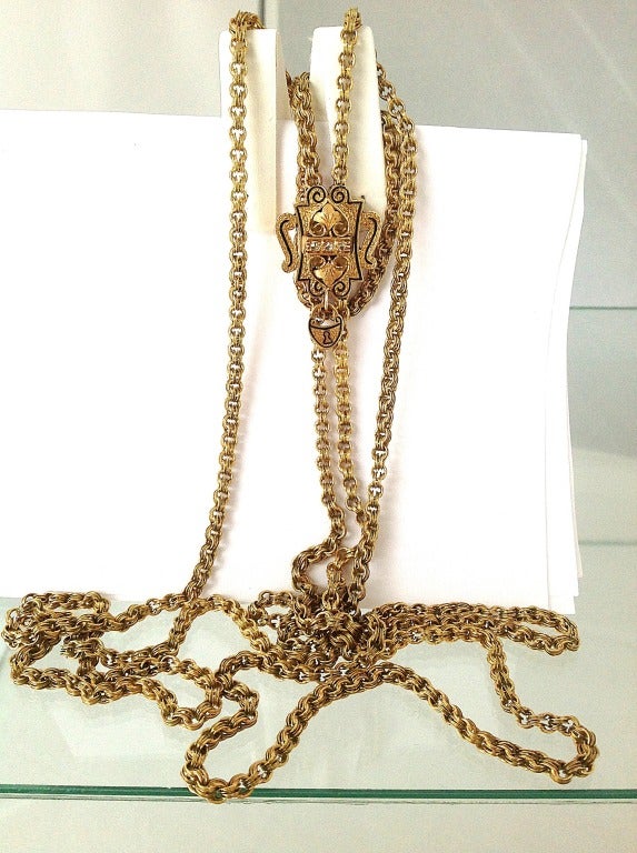 Superbly chic, full length, gold Sautoire, with original gold slider accented with rose cut diamonds and enamel 
Chain is in excellent condition, slider works beautifully. 
Please review dimensions, full length is rare for these pieces.