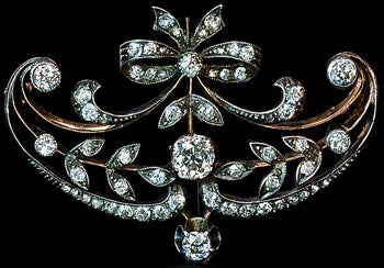 An Elegant Belle Epoque Diamond Brooch Pin.

Made in Moscow between 1908 and 1917.

This finely handcrafted antique brooch is designed in garland style of the 1910s.  The brooch / pin is set with old mine, Old European and rose cut diamonds with