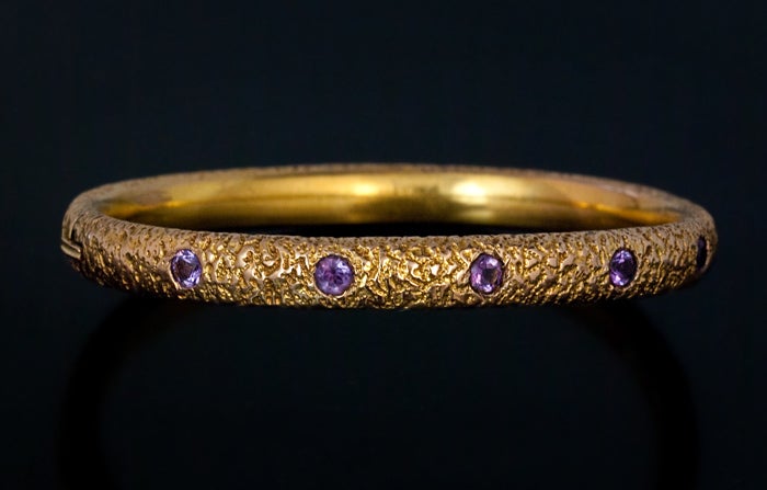 Jewelry imitating gold nugget texture was popular in the 1880s-1890s. 

This stylish Russian gold nugget bangle bracelet was made in St Petersburg between 1882 and 1898. 

The bracelet is set with five round amethysts.

Weight - 12.2 g
