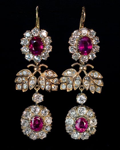 A pair of magnificent ruby and diamond double cluster earrings. Marked with 56 zolotniks gold standard (14K - 583)/ St Petersburg assay office, and jeweler's initials Cyrillic 'AB'