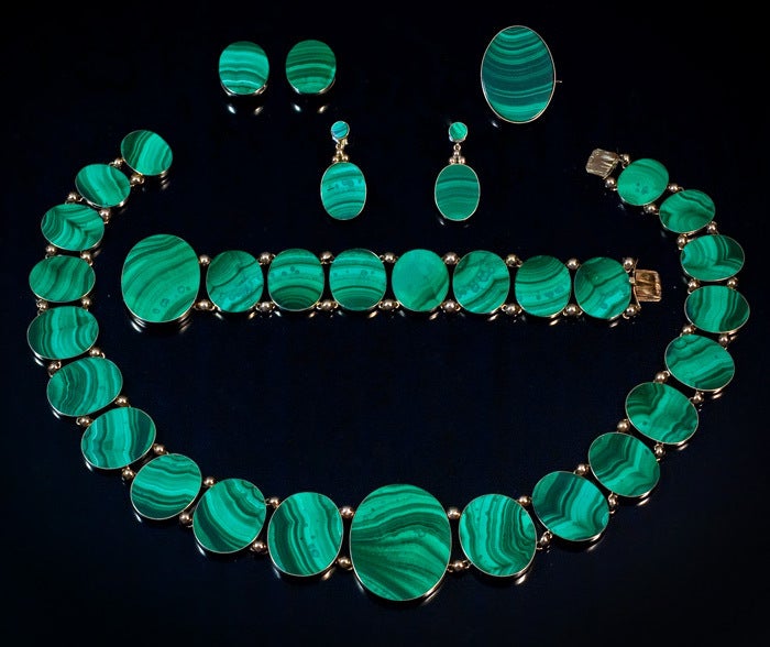 This magnificent museum quality antique suite (parure) of malachite jewelry is a great rarity. Russian 19th century large suites of jewelry are not seen on the market.
The original brown leather case significantly increases the rarity of the