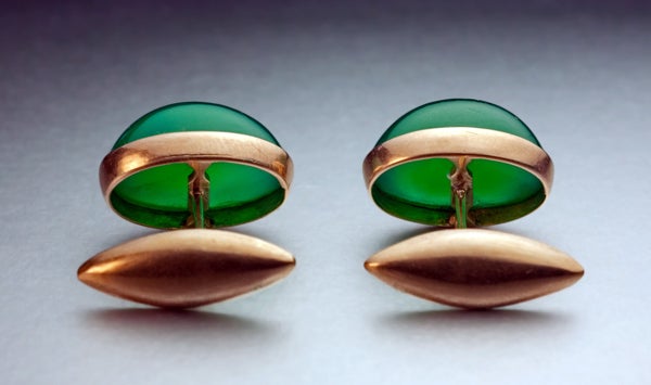 14K gold cufflinks are set with cabochon-cut glowing green chrysoprases.

Chrysoprase is a valuable variety of chalcedony gemstones.

Made in the city of Odessa between 1908 and 1917.

Marked with 56 zolotnik old Russian gold standard and