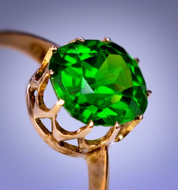 A Vintage Solitaire Demantoid Ring

circa 1910

A rose gold ring is set with an exceptional antique cushion cut Russian Uralian demantoid garnet.

The demantoid has a beautiful emerald green color and is filled with fire. 

Demantoids over 1