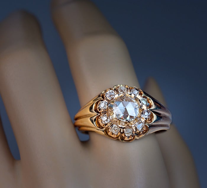 This massive fluted gold gentlemen's cluster ring features a beautiful 0.73 ct Full Holland Rose cut diamond (color J, clarity VS1),  surrounded by ten old mine cut diamonds with an approximate total weight of 1.20 ct.

Total estimated diamond
