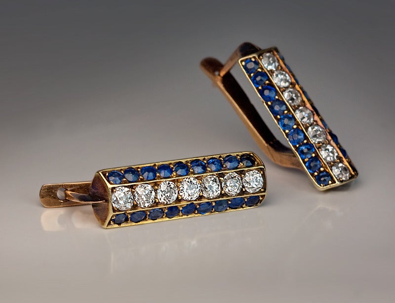 circa 1915

of a slightly flattened, long hexagonal prism shape set with 14 old cut bright white diamonds with an approximate total weight of 0.80 ct and 36 natural blue sapphires with an approximate total weight of 1.44 ct.

Handcrafted in