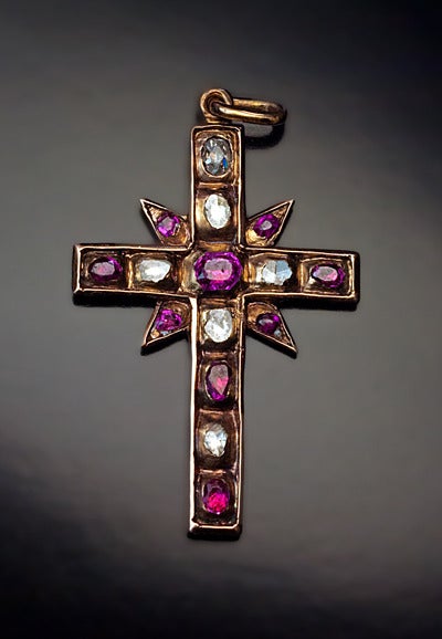 An Exceptionally Rare 

Ruby, Diamond and Gold Cross Pendant

Renaissance, circa 1580

The cross is embellished with 9 faceted rubies and 6 diamonds in rub-over settings.

Five diamonds are very early rose cuts, stones are flat and crudely
