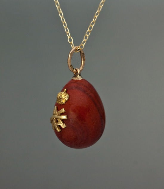 An Exceptionally Rare Royal Romanov Egg Pendant by Faberge

Made in St. Petersburg between 1908 and 1917

A carved reddish brown jasper miniature egg is applied with a cypher of Grand Duchess Ksenia (Xenia) Alexandrovna, sister of Tsar Nicholas