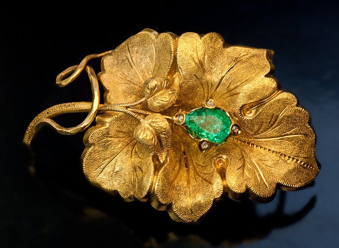 Victorian Gold and Emerald Grape Leaf Earrings and Brooch

They are designed as stylized grape leaves embellished with emeralds and rose cut diamonds.

The leaves are superbly chased and engraved to imitate real grape leaf structure.

The
