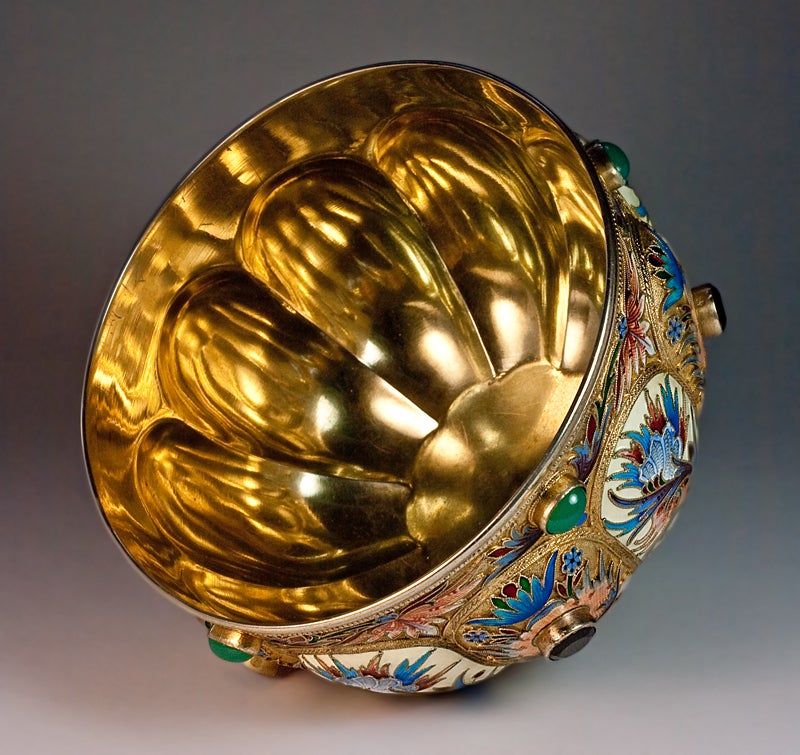 This exquisite Russian Imperial era silver-gilt and shaded cloisonne enamel jeweled bowl (bratina) was made in Moscow in the 1890s by Nicholas Alexeev.
Height 3 1/2 in. (9 cm). Diameter 5 in. (12.8 cm).
Weight 396 grams (14 oz).
The lobed body is