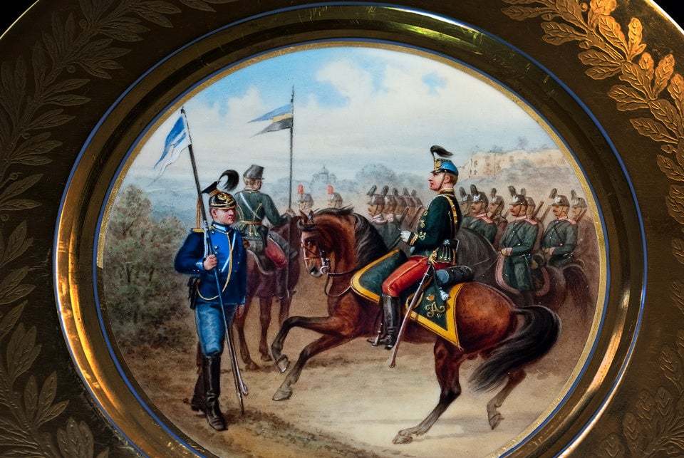 The center is painted with cavalry officers of three Life Guard regiments of the 2nd Cavalry Division wearing the uniforms from the reign of Tsar Alexander II.

The polished gold border is decorated with an etched matte gold Russian double headed