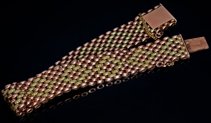 A Heavy Vintage Russian Two Color Gold Woven Bracelet.

The polished rose gold bracelet is decorated with rhombuses of textured green gold. 

The bracelet was made in Odessa between 1908 and 1917.

width - 9/16 in. (1,5 cm)

length - 7 3/4
